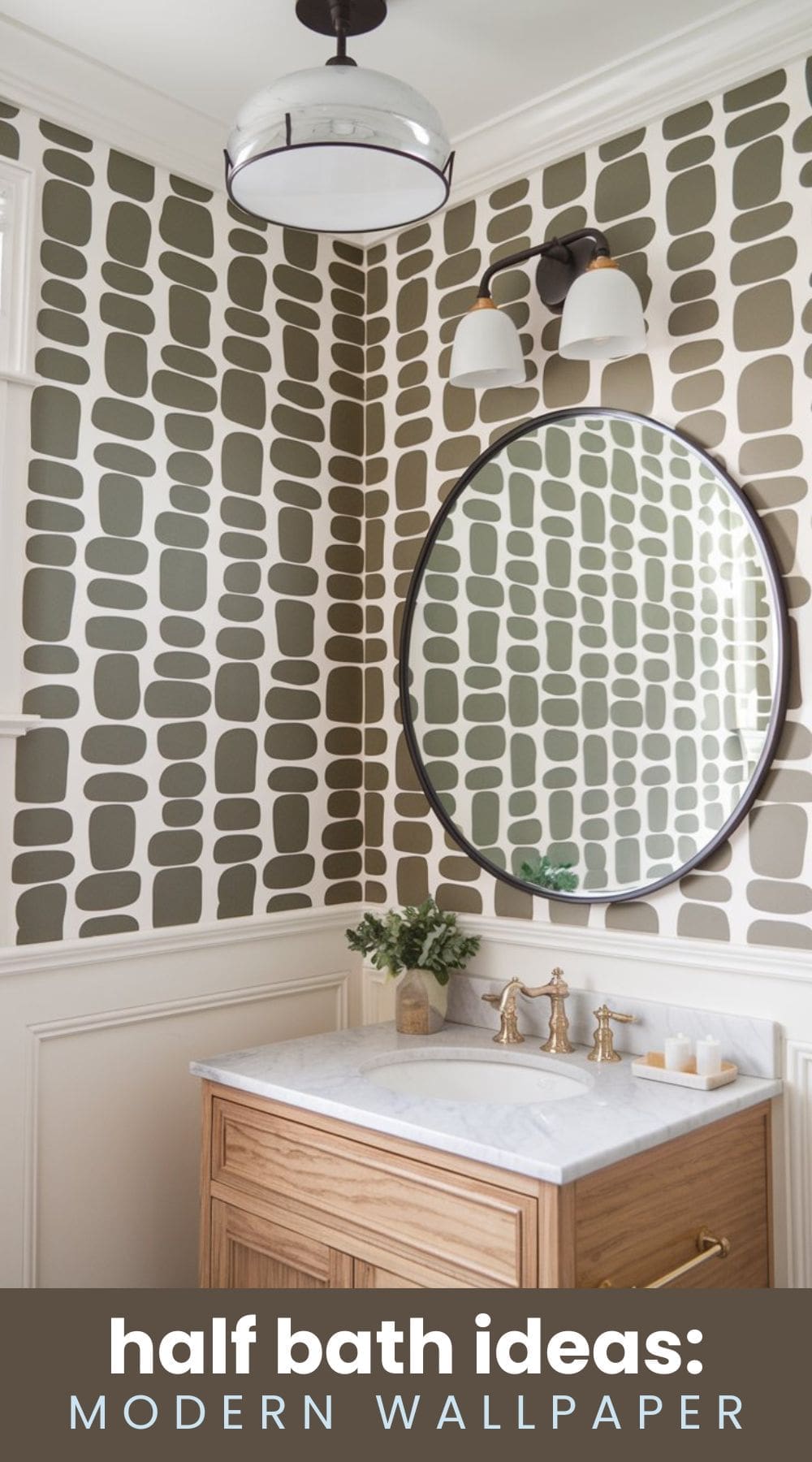Bathroom with green and white modern geometric wallpaper. Features a circular mirror, wooden vanity with marble top, gold faucet, small vase of greenery, and twin wall sconces. Ceiling light fixture adds to contemporary design. Text reads: half bath ideas: Modern Wallpaper.