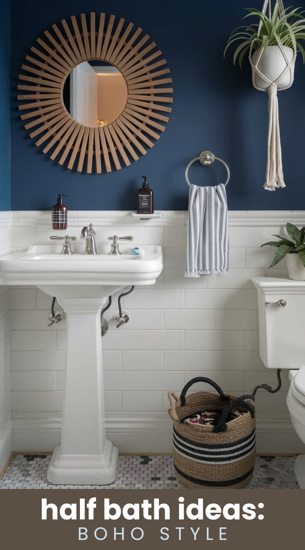 A boho-style half bath featuring a white pedestal sink, wicker mirror, dark blue wall, and white tile. A striped towel hangs on a ring, plants adorn the space, and a woven basket sits on the floor. Bottles are on the sink. Text reads half bath ideas: BOHO STYLE.
