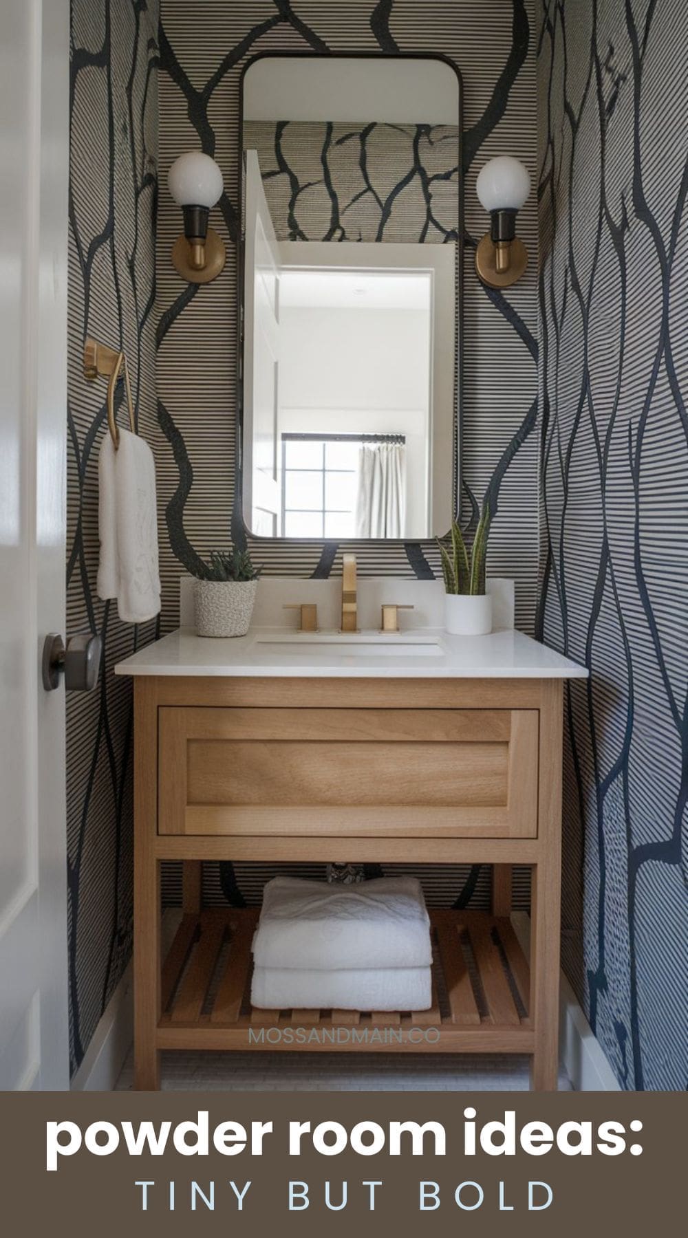 A small powder room with bold patterns. The walls feature a dark, abstract design. A wooden vanity with a white countertop holds a rectangular mirror, two wall sconces, and a plant. Text at the bottom reads, powder room ideas: tiny but bold.